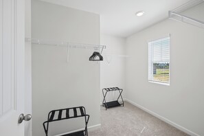 Closet space with a luggage rack so you can settle in for the stay - Courtside Manor, 5BR Across from Berry Tennis (Rome)