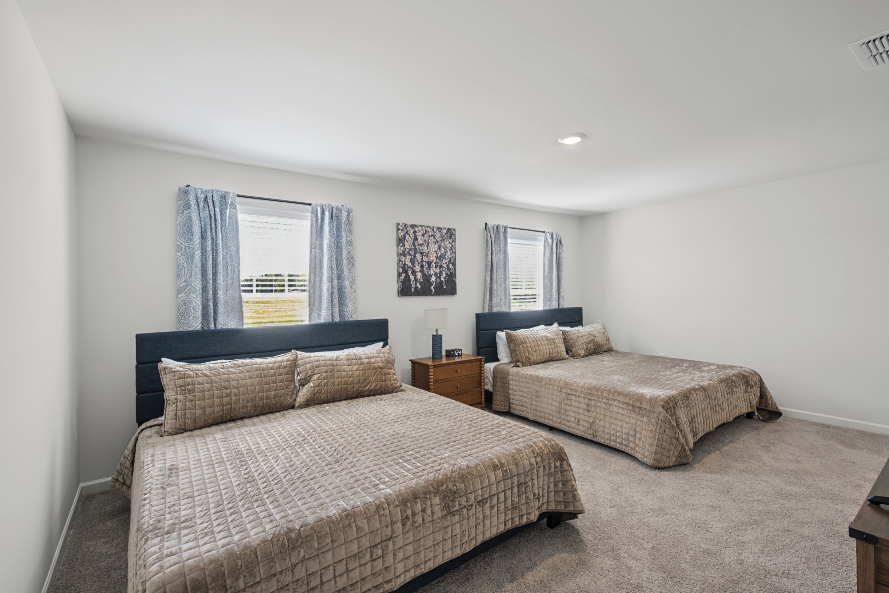 Bedroom on the second floor with two king beds, ideal for couples or families sharing a room