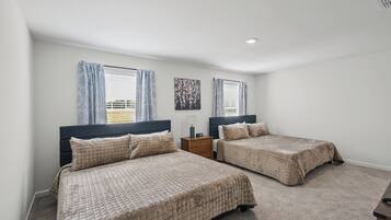 Bedroom on the second floor with two king beds, ideal for couples or families sharing a room
