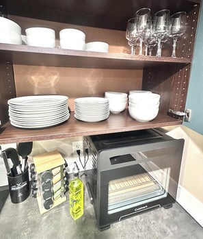 A kitchen with a built-in oven, a coffee machine, and various kitchen utensils. - Zen Retreat 3BD Near Lake Murray + SDSU with Gazebo (La Mesa)