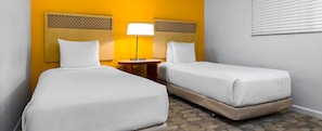 A hotel room with two single beds, a bedside table with a lamp, and a patterned carpet. - 3-BR 2-bath condo at Worldmark Kihei Resort, best beach across the street (Kihei)