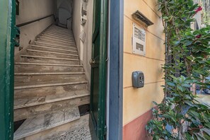 A staircase leading to a door with a security keypad on the wall. - [SeaSoul] Sea 100m • 6 Guests • Historic Centre (Albissola Marina)