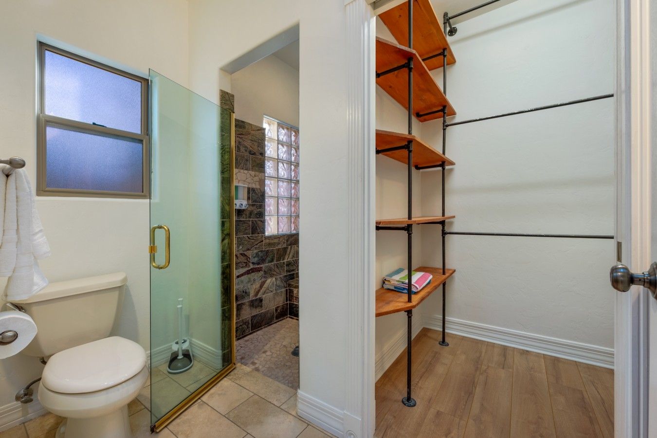 Full bathroom with beautifully tiled walk-in shower