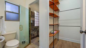 Full bathroom with beautifully tiled walk-in shower