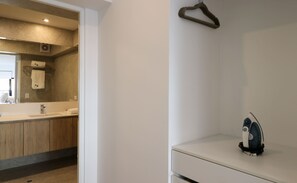 A modern bathroom with a mirror, sink, and a towel rack. - w* | Deluxe 2BR w/ Terrace in Miraflores (Miraflores)
