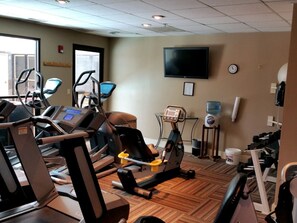 A gym with treadmills, stationary bikes, and a water dispenser. - NEW LISTING - 281 Slopeside King Bed Studio, views, Pet friendly (Crested Butte)