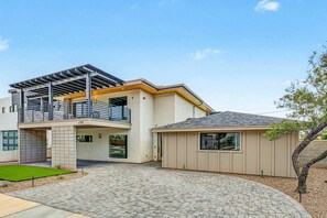 A two-story house with a balcony, a garage, and a small shed. - Casa Saguaro Old Town: 6BR Heated Pool Hot Tub (Scottsdale)