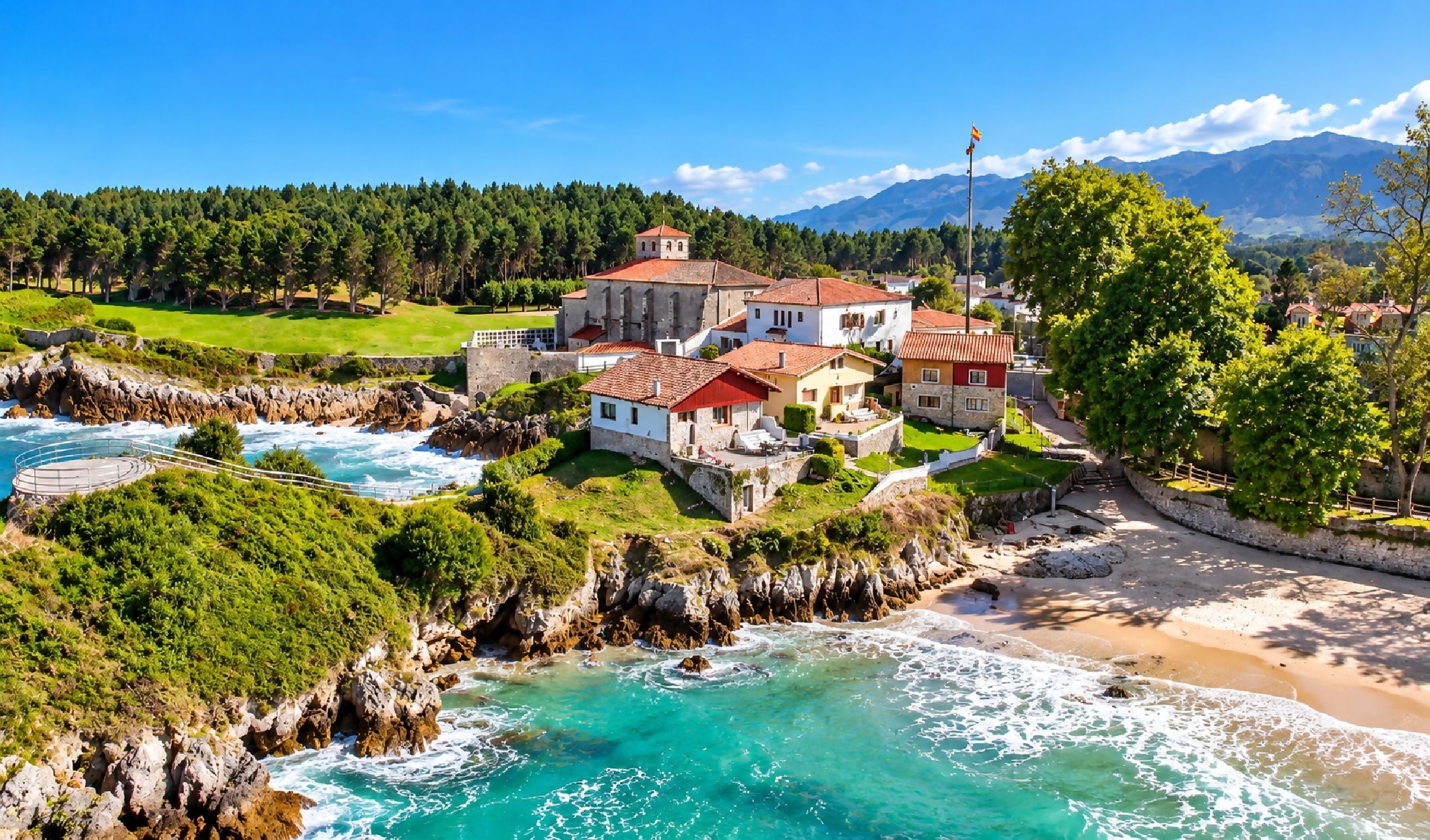 A coastal property with multiple buildings, a beach, and a rocky shoreline.