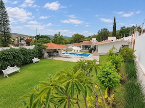A residential backyard with a swimming pool, outdoor furniture, and a white fence. - Mansion Maria - 5 Luxury Suites & Heated Pool (San Felipe del Agua)