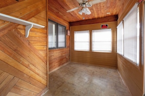 A room with wooden walls, a ceiling fan, and a 'No Smoking' sign. - The Crew House! Spacious 4-bedroom & 3-Bathrooms with 7 Beds! (Amarillo)