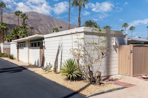 A modern house with a white exterior, a garage, and a driveway. - Mod Pad 2.0 | Historic Ocotillo Lodge | Pool (Palm Springs)