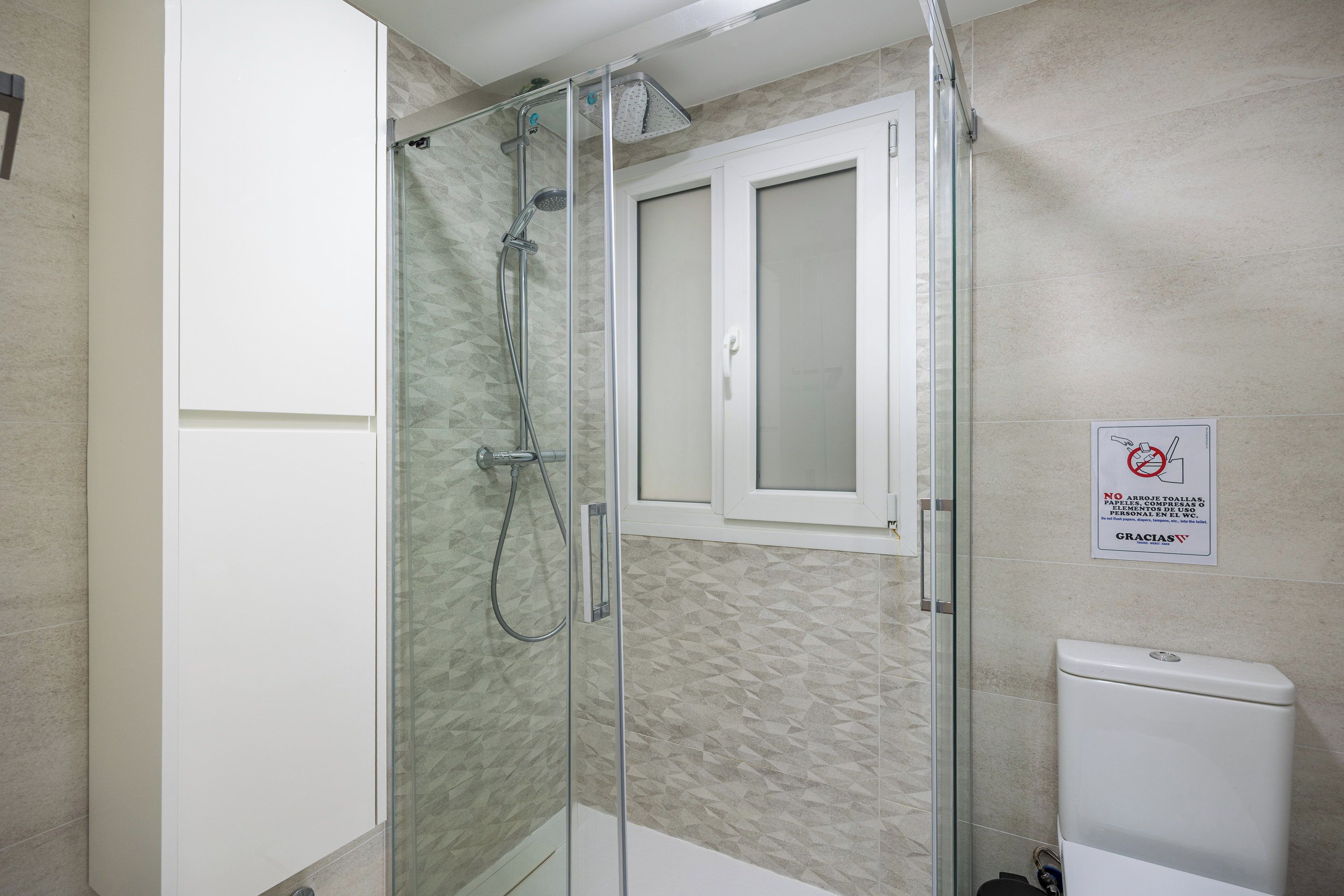 Contemporary shower area with high-quality finishes.