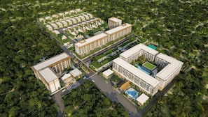 A large, modern hotel complex with multiple buildings, a central courtyard, and a swimming pool. - OZON OASIS Apartment by TVC (Choeng Thale)