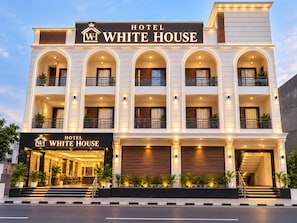 A multi-story hotel with a prominent sign reading 'Hotel White House.' - Hotel White House  (Ghaziabad)