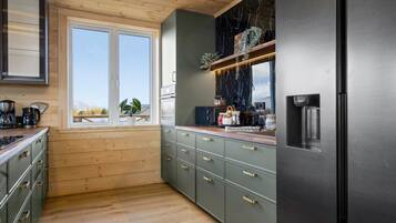 Fully equipped kitchen with large fridge-freezer