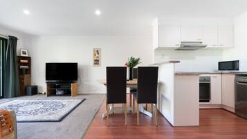 Enjoy the spacious open-plan living and dining area, thoughtfully arranged for relaxing, dining and spending quality time together.