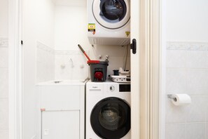 A bright and practical laundry area provides convenient facilities to help make your stay comfortable and hassle-free. - 1BR with Pool and Large Balcony Near Manuka (Griffith)