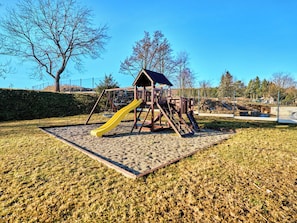 A playground with a slide and climbing structures. - George 03 by Interhome (Kovářská)