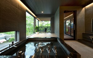 A modern bathroom with a large window, a bathtub, and a shower area. - Hachimenzan Happo (Nakatsu)