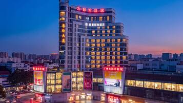A modern hotel with multiple floors and a prominent entrance.