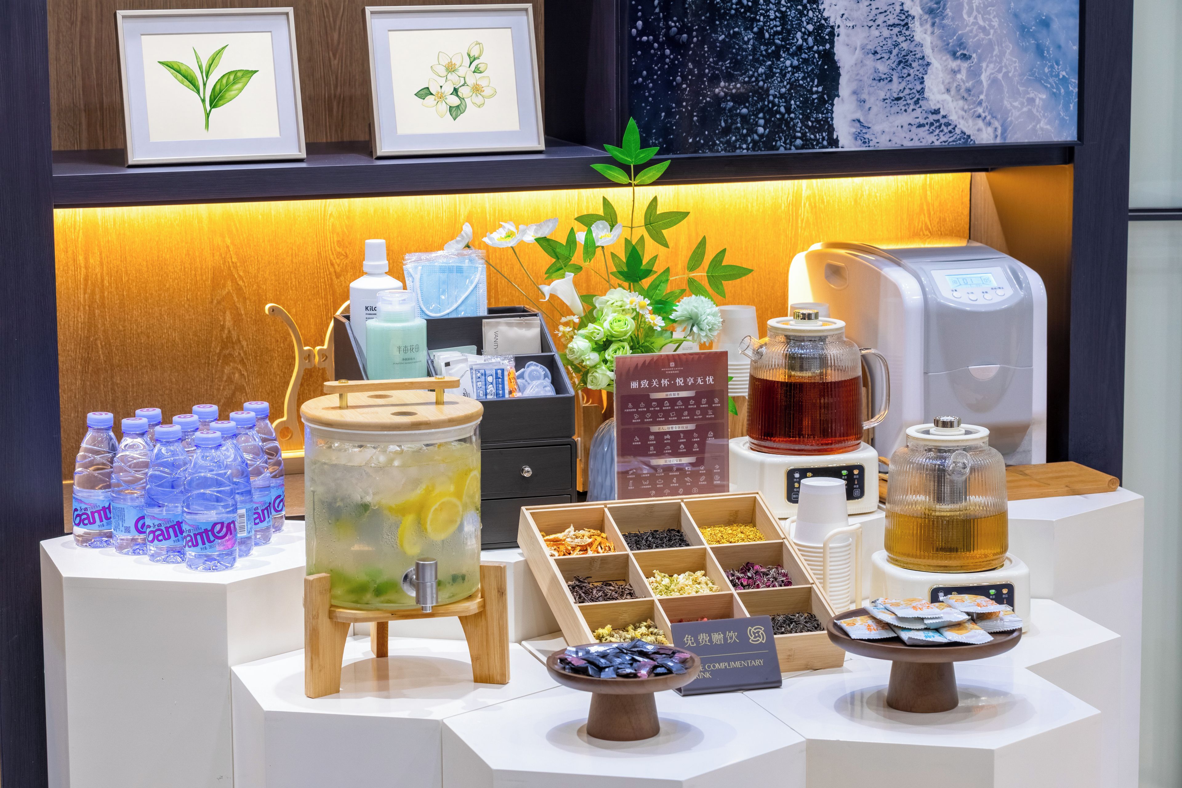 A beverage station with various drinks, a tea dispenser, and a selection of snacks.