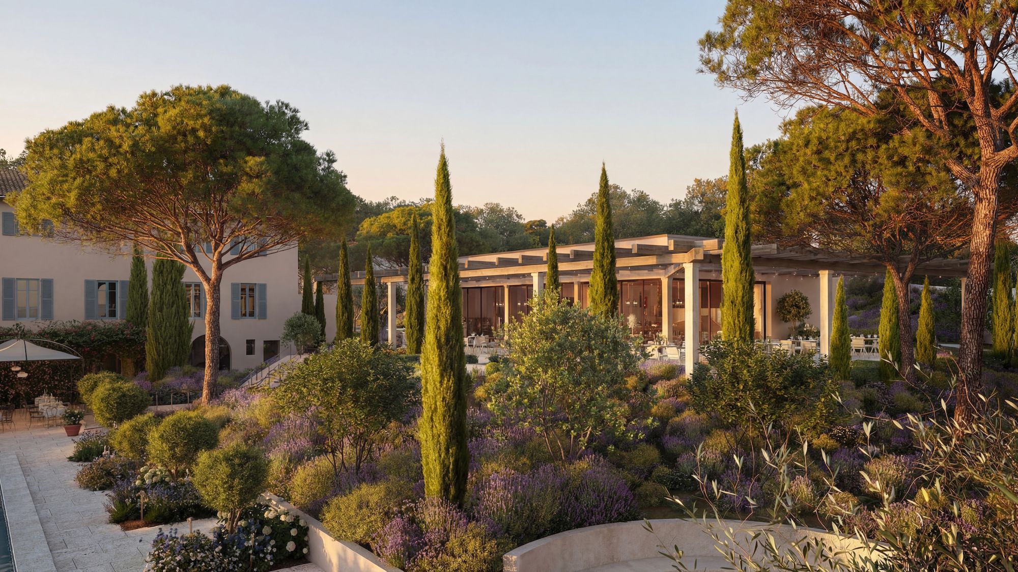 A landscaped garden with a variety of trees and shrubs, a pergola structure, and a building with a modern architectural style.