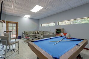 A room with a pool table, a sofa, and a window. - Walk to Creek! 10-Acre 'Spring Creek Lodge' (Blue Ridge)