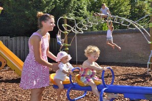 A playground with a seesaw and climbing equipment. - Chalet for 2 to 4 people Cosy (Renesse)