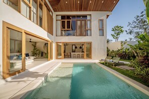 A modern two-story house with a swimming pool, outdoor seating, and a well-maintained garden. - Villa GIGI Balangan (Balangan)