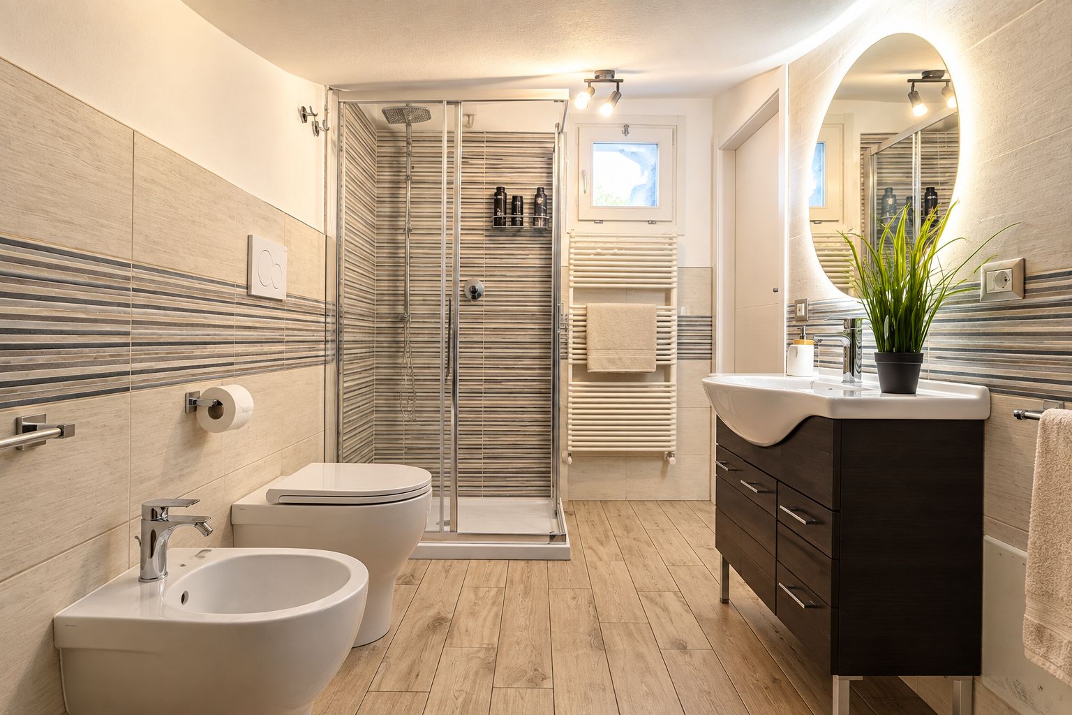 Ein modernes Badezimmer mit Dusche, Bidet, Waschtisch und einem großen Spiegel.