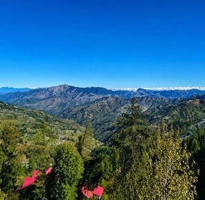 A mountainous landscape with a clear sky. - SINGHBHUM-The Mist Vally (Theog)