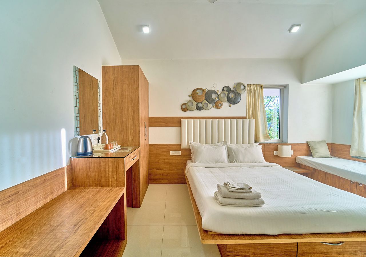 A modern bedroom with a wooden bed, a bedside table, a built-in wardrobe, and a decorative wall piece.