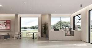 A modern hotel room with large windows, a dining area, and a kitchen counter. - SHANKEE Hotel M Blok Jakarta (Jakarta Selatan)