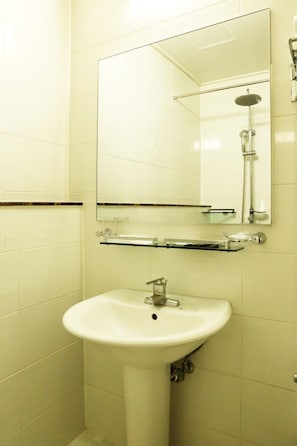 A bathroom with a white sink, a mirror, and a shower. - The Hotel Yeongjong Incheon Airport (Incheon)