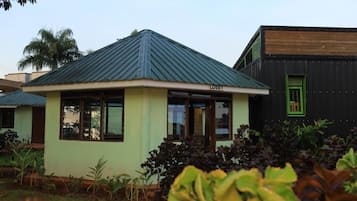 A building with a green roof and a sign labeled 'LOBBY'.