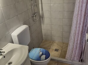 A bathroom with a toilet, a sink, and a shower. - Apartments Marija Sukosan - Classic One Bedroom Apartment (Sukosan)