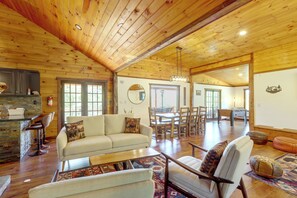 A spacious living area with a high wooden ceiling, a sofa, a dining table with chairs, and a pool table. - Walk to Creek! 10-acre 'spring Creek Lodge' (Blue Ridge)