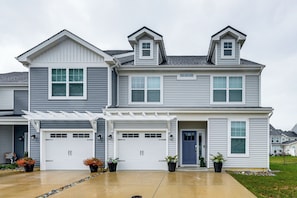 A two-story residential house with a garage, a covered patio, and a front door. - 5 Mi to Bethany Beach! Family & Pet-friendly Haven (Ocean View)