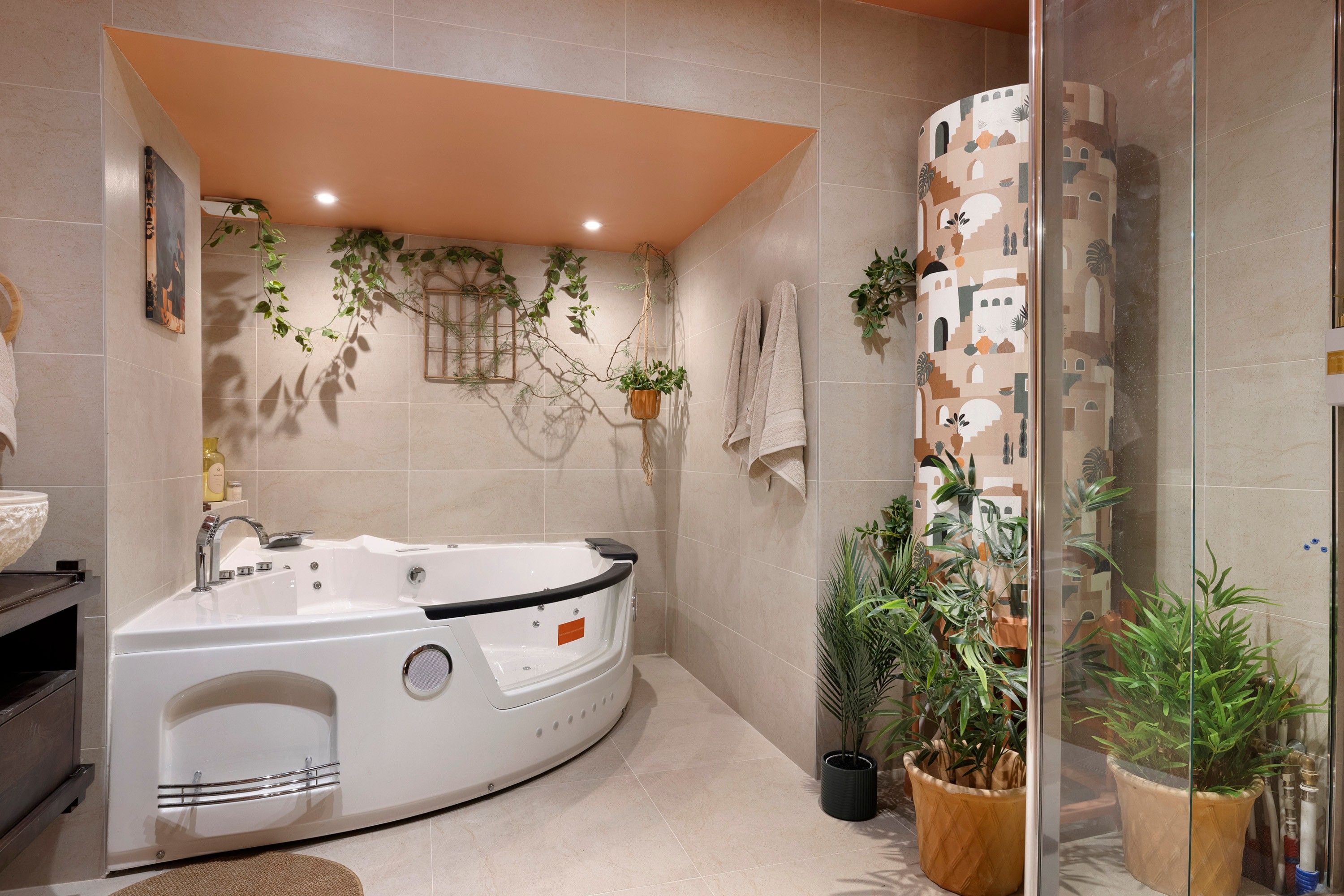 A modern bathroom with a freestanding bathtub, a glass shower enclosure, and various potted plants.