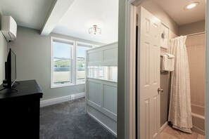 A bathroom with a shower, a toilet, and a sink. - Historic Old Town 5BR/5BA stay in Park City. (Park City)
