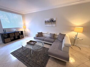 A living room with a sofa, coffee table, and lamps. - Luxury Las Vegas Strip!  1BR Private Residences Condo ~ 24/7 Pool 2-03 (Las Vegas)