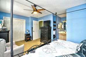 A bedroom with a bed, a dresser, a television, and a ceiling fan. - Sea Horse Beach House 2BR 3BA Sleep7,with Pool Near Cherry Grove4Mile From Beach (Little River)