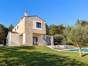 A modern two-story house with a stone facade, a swimming pool, and a well-maintained lawn. - Villa Casa Venus - Three Bedroom Villa, Sleeps 6 (Sveti Ivan)