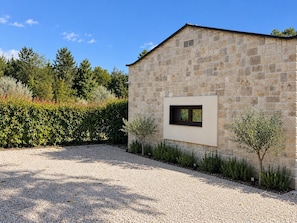 A stone building with a small window, surrounded by gravel and low shrubs. - Villa Casa Vesta - Two Bedroom Villa, Sleeps 4 (Sveti Ivan)