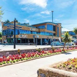 A modern building with a restaurant named 'ocean' on the ground floor. - The Exmouth Nook, Walk to Beach, Parking Nearby (Exmouth)