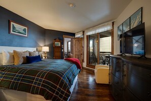 A bedroom with a bed, a dresser, a television, and a window. - Bright Mountain Modern Condo @ The Lodge in Steamboat Springs! (Steamboat Springs)