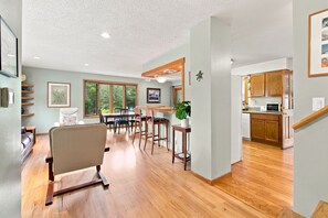 A modern interior with a dining area, kitchen, and a staircase. - Relaxed 4BR Boulder Home Near CU & Mountains (Boulder)