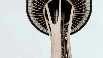 A tall tower with a large circular observation deck at the top.
