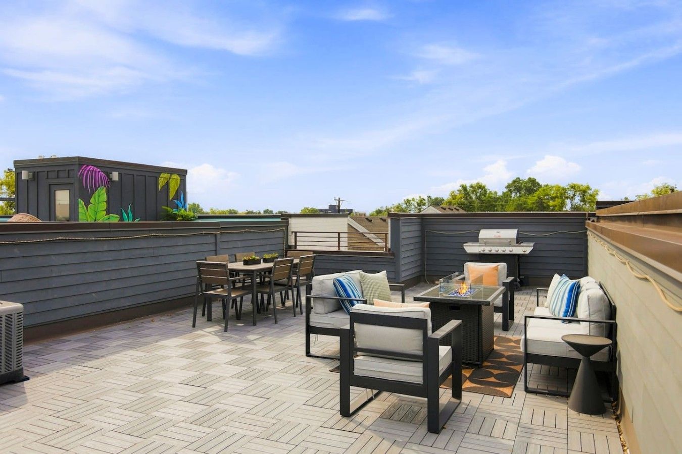 Enjoy our spacious rooftop patio. It includes a grill, outdoor dining table, and additional seating surrounding the firepit. *Please note, we do not supply propane. There may be some left from the previous guest.
