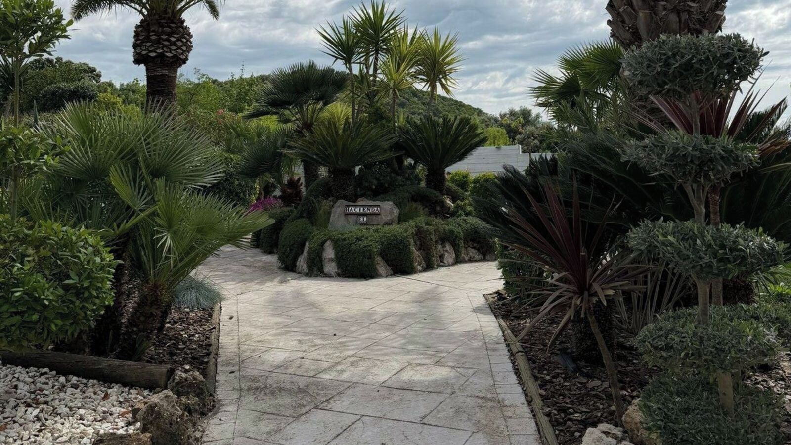 A paved pathway leading to a sign labeled 'HAGENDORN.'